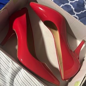 Red MK heels never worn